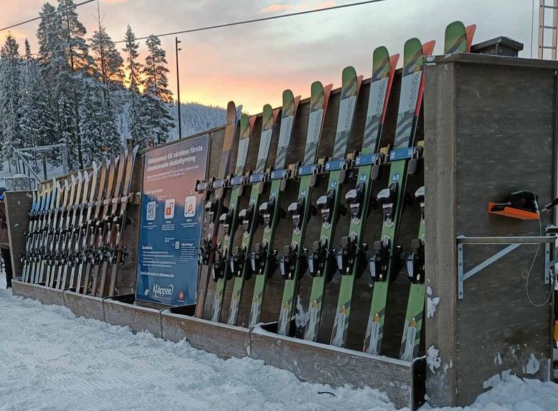 Unmanned ski rental rack beside the lift at Kläppen ski resort in Sälen, Sweden: every pair of skis has its own code padlock