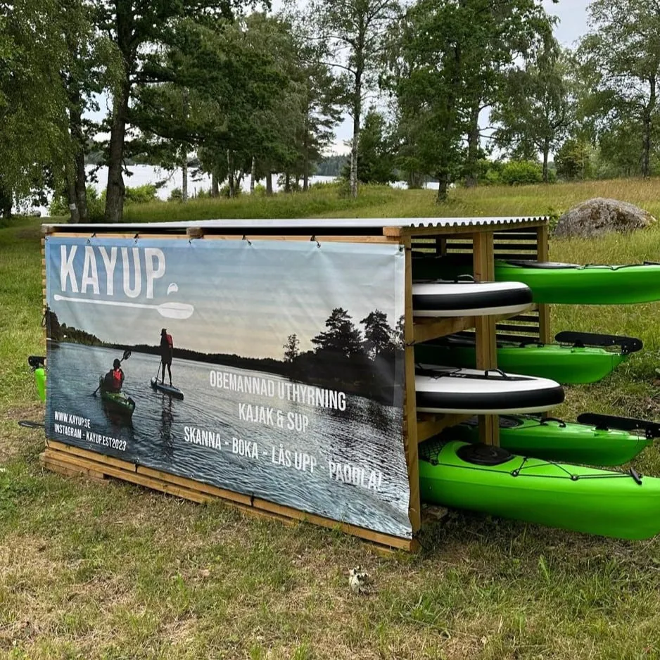 Self-service kayak and SUP station with commercial banner on the side