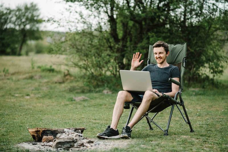 Business owners working on a laptop outdoors