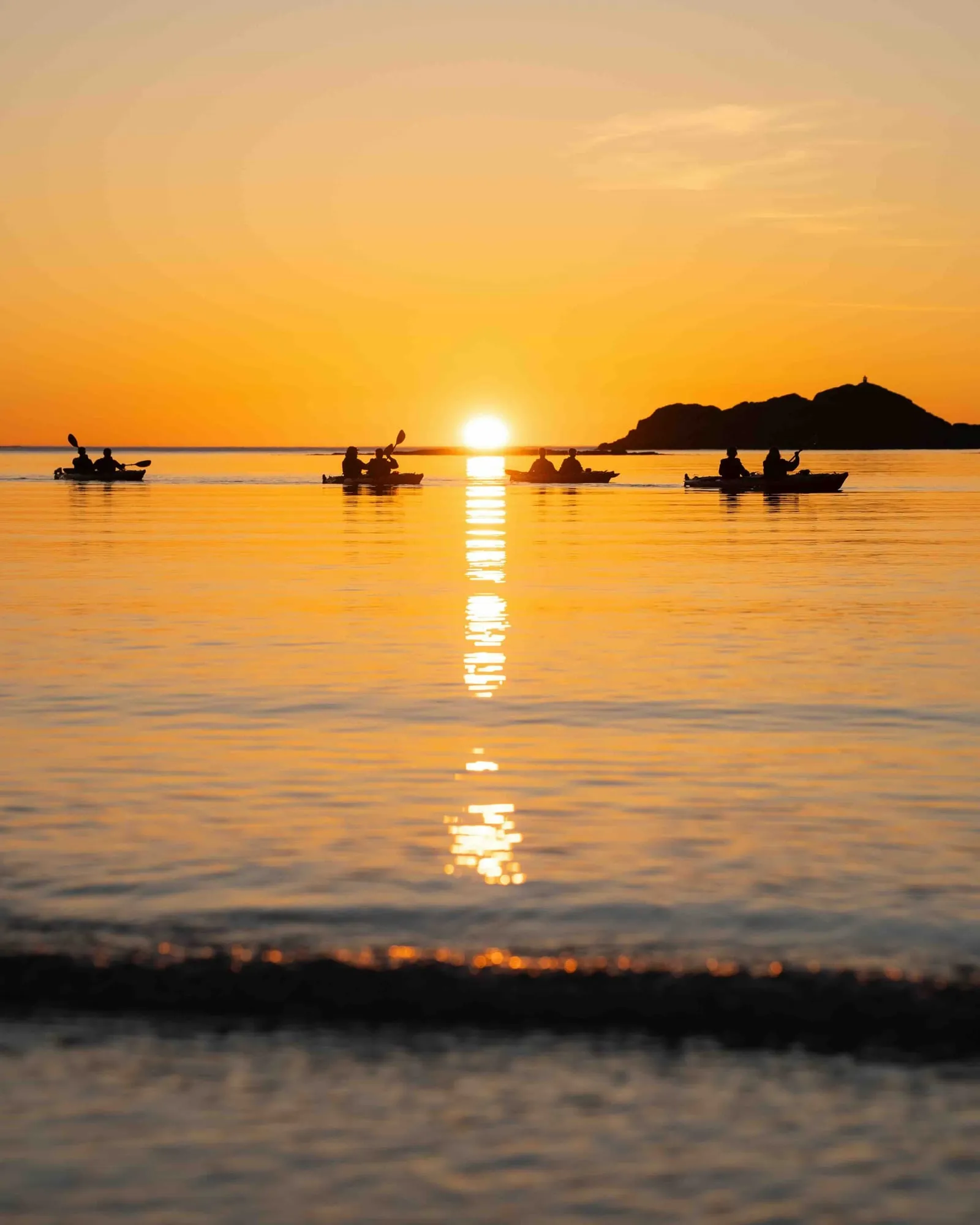 Kayaking at sunset in Lofoten, Norway