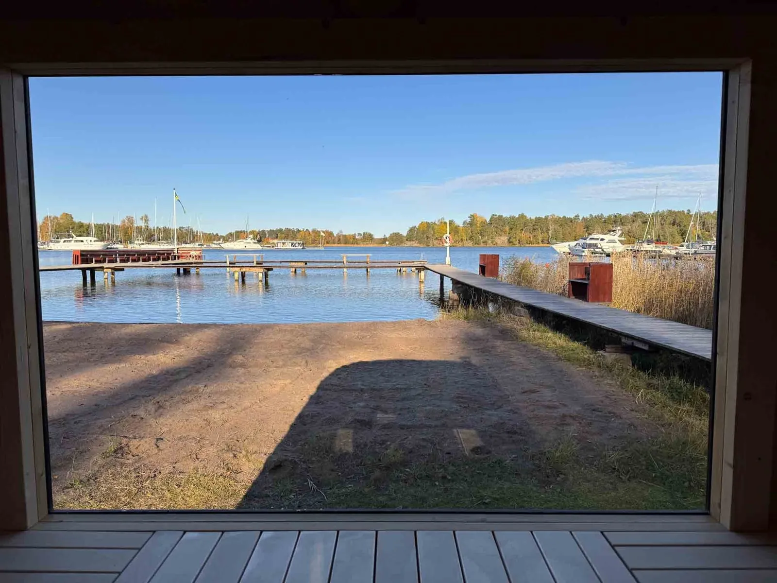 Scenic view of Svinninge harbor from inside Lilla Sauna’s sauna